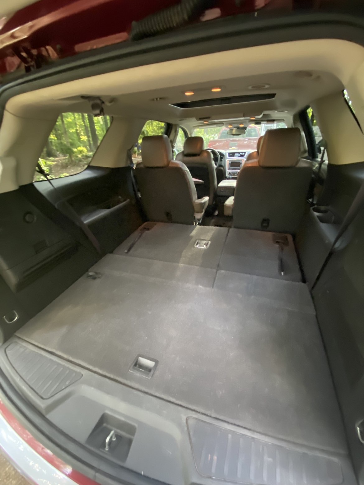 Vacuumed cargo area and folded rear seats after an interior detail